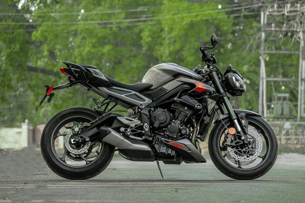 How do I replace the coolant overflow tank on a Triumph Street Triple R?